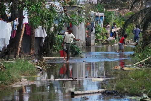 Image of a stream with several people on the bank