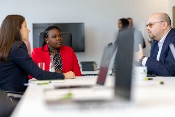 Three employees exchanging ideas